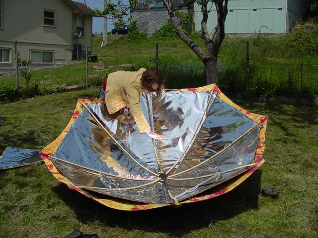File:Umbrella solar cook hand.jpg