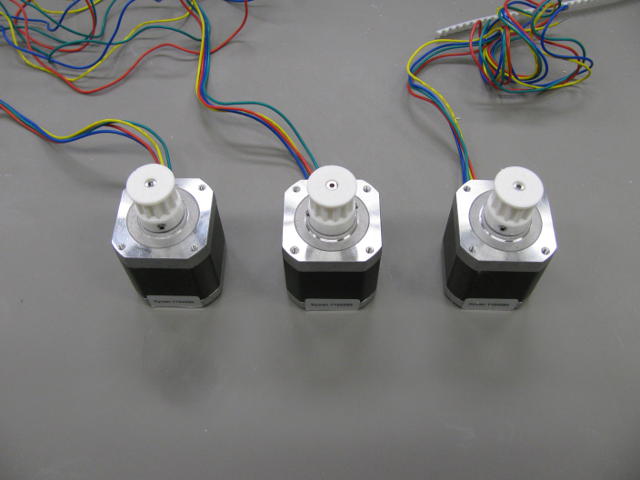 Motors with pulleys.