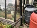 CCAT greenhouse rainwater catchment First flush using a long black pipe.