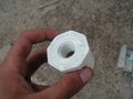 One-and-a-half to one-half inch PVC reducer.