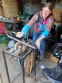 Holly removing rust with the CCAT pedal grinder