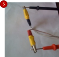 Attach free end of the wire to volt meter leads: Red alligator clamp to red volt meter lead and Black alligator clamp to black volt meter lead.