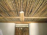 A ceiling made with bamboo poles.