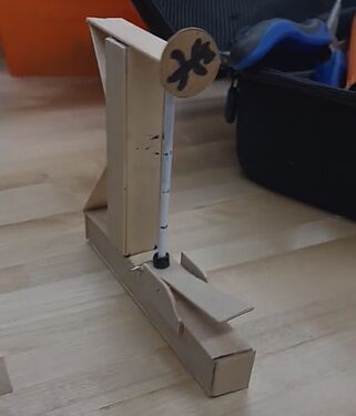 Scaled-down popsicle stick prototype of the High Striker Game, the first project solution that was later changed