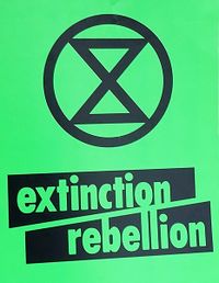 Extinction Rebellion, green placard (cropped).jpg