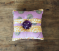 Sew a button into the centre of the cushion for a simple finish