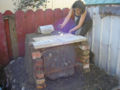 Eva decorated the sides of the stove with some cob